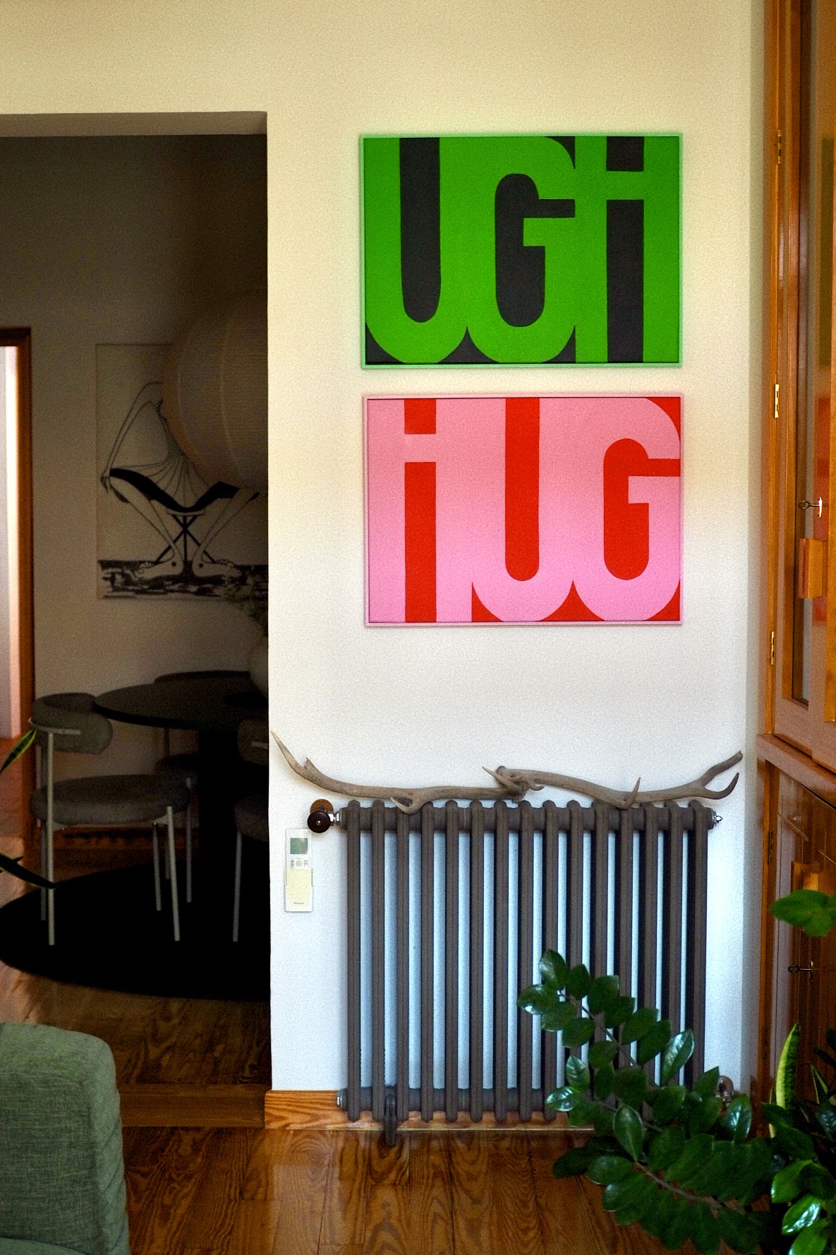 UGH HUG painting by Ariana Escobar installed on wall